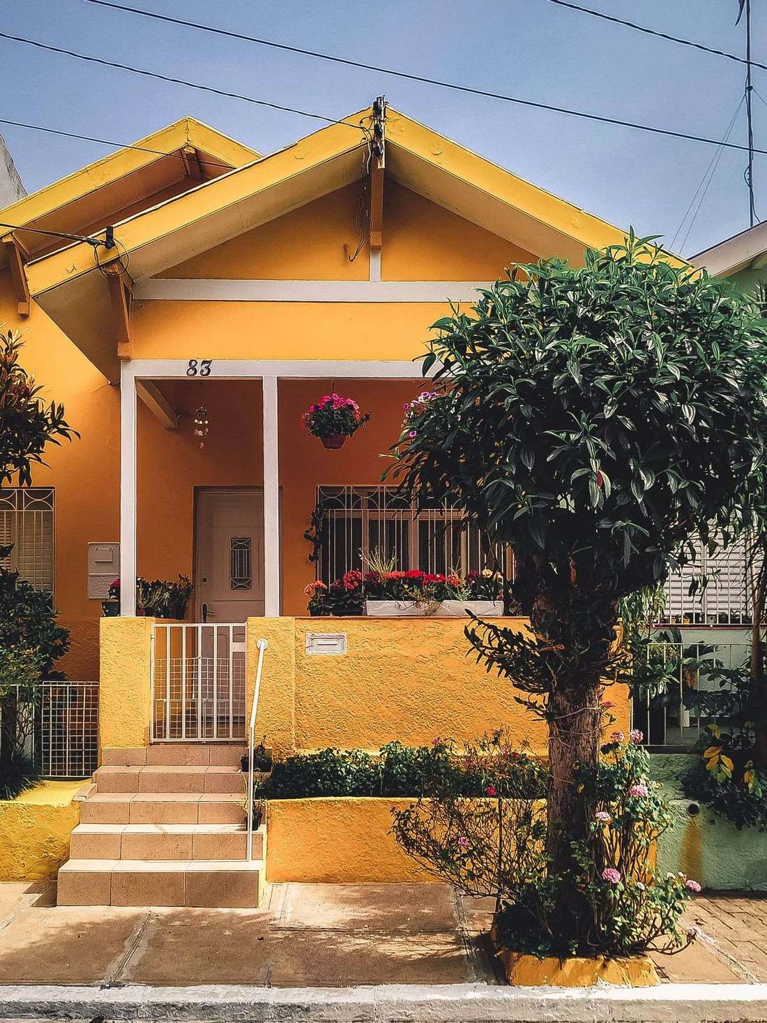 A colorful neighborhood house, the kind of block Kyros builds for